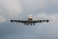 Large passenger plane landing on the airport during stormy weather Royalty Free Stock Photo