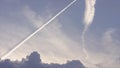 Large passenger supersonic plane flying high in clear blue sky, leaving long white trail. Airplanes leaving diagonal Royalty Free Stock Photo