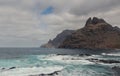 large pebble mountain by the calm sea in an arid environment of the canary islands under cloudy skies Royalty Free Stock Photo