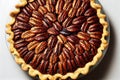 Large pecan pie tart with nuts in shortbread dough on table