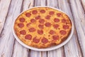 Large pepperoni pizza with lots of pepperoni and lots of melted cheese Royalty Free Stock Photo