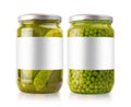Large pickled cucumbers and pea jars with white labels on white background Royalty Free Stock Photo