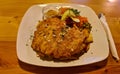 Large piece of fried pork chop with potatoes and fresh salad on plate Royalty Free Stock Photo