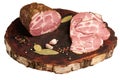 Large piece of pork ham and sliced ham on a kraft wooden board. Delicious baked meat with spices in close-up. Top view. Large Royalty Free Stock Photo