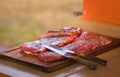 Large piece of raw red meat ready to be grilled. Typical argentinian food, asado Royalty Free Stock Photo