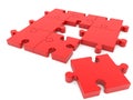 A large piece of red puzzle close-up on the background of the puzzle