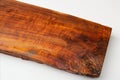 A large piece of wood with a brown stain