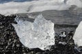 large pieces of iceburg on black sand beach in Iceland