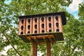 Large pigeon bird house constructed to exchange eggs for fake eggs to reduce pigeon population in cities