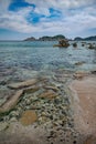 A large pile of boulders in shallow water Royalty Free Stock Photo