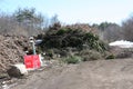 Large pile of branches and twigs to become wood chips