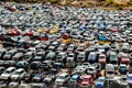 A large pile of cars are stacked on top of each other