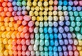 a large pile of colorful stacked chalks