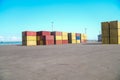 A large pile of containers are stacked in a warehouse Royalty Free Stock Photo