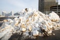 Large pile of dirty snow on background of city Royalty Free Stock Photo