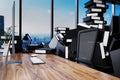 Large pile of document folders and stack of ring binders flooding modern office workplace with pc and skyline view; burnout
