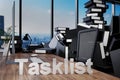 Large pile of document folders and stack of ring binders flooding modern office workplace with pc and skyline view; tasklist