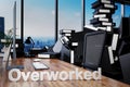 Large pile of document folders and stack of ring binders flooding modern office workplace with pc and skyline view; overworked