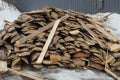 A large pile of firewood from brown pine boards Royalty Free Stock Photo