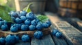 A large pile of fresh blueberries scattered on a rough wooden surface. Royalty Free Stock Photo