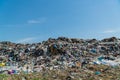 A large pile of garbage is in a landfill. Household waste garbage. Problems with waste processing