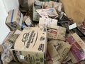 Messy cardboard boxes stored in a warehouse