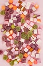 A large pile of mixed sweets on wooden background Royalty Free Stock Photo