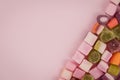 A large pile of mixed sweets on wooden background Royalty Free Stock Photo