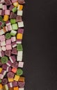 A large pile of mixed sweets on wooden background Royalty Free Stock Photo