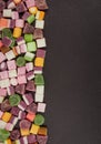 A large pile of mixed sweets on wooden background Royalty Free Stock Photo