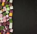 A large pile of mixed sweets on wooden background Royalty Free Stock Photo