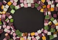 A large pile of mixed sweets on wooden background Royalty Free Stock Photo