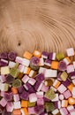 A large pile of mixed sweets on wooden background Royalty Free Stock Photo