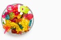 A large pile of multi-colored jelly gummy candies in a glass bowl on a white background Royalty Free Stock Photo