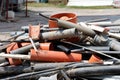 Large pile of old used broken plastic and rubber pipes left at local construction site Royalty Free Stock Photo
