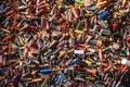 Large pile of old, used, corroded batteries at a recycling centre