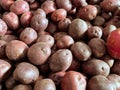 Large pile of red unpeeled raw potatoes display at a farmers marketing Royalty Free Stock Photo