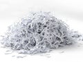 A large pile of shredded white paper against a clean white background. This image represents concepts of data security,