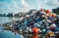 Large pile of various discarded plastic waste near waterfront. Pollution problem visible in nature. Waste disposal issue. Many