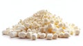 large pile of white marshmallows sits on a white background, with some of the marshmallows shattered into tiny pieces Royalty Free Stock Photo