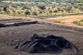 Large piles of processed Manganese ore rock