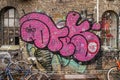 Large pink graffiti, Christiania, Copenhagen, Denmark Royalty Free Stock Photo