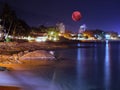 Large pink moon over the Patong beach skies of Phuket Thailand Royalty Free Stock Photo