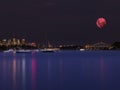 Large pink moon over the Patong beach skies of Sydney Australia Royalty Free Stock Photo