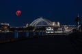 Large Pink moon rising behind Sydney CBD buildings NSW Australia Royalty Free Stock Photo