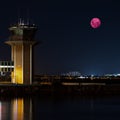 Large Pink moon rising behind Sydney CBD buildings NSW Australia Royalty Free Stock Photo