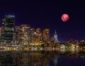 Large Pink moon rising behind Sydney CBD buildings NSW Australia Royalty Free Stock Photo