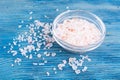 Large pink sea salt on blue background Royalty Free Stock Photo