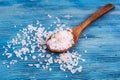 Large pink sea salt on blue background Royalty Free Stock Photo