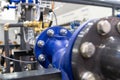 Large pipes in an industrial boiler room. Equipment for centralized hot water supply. Close-up